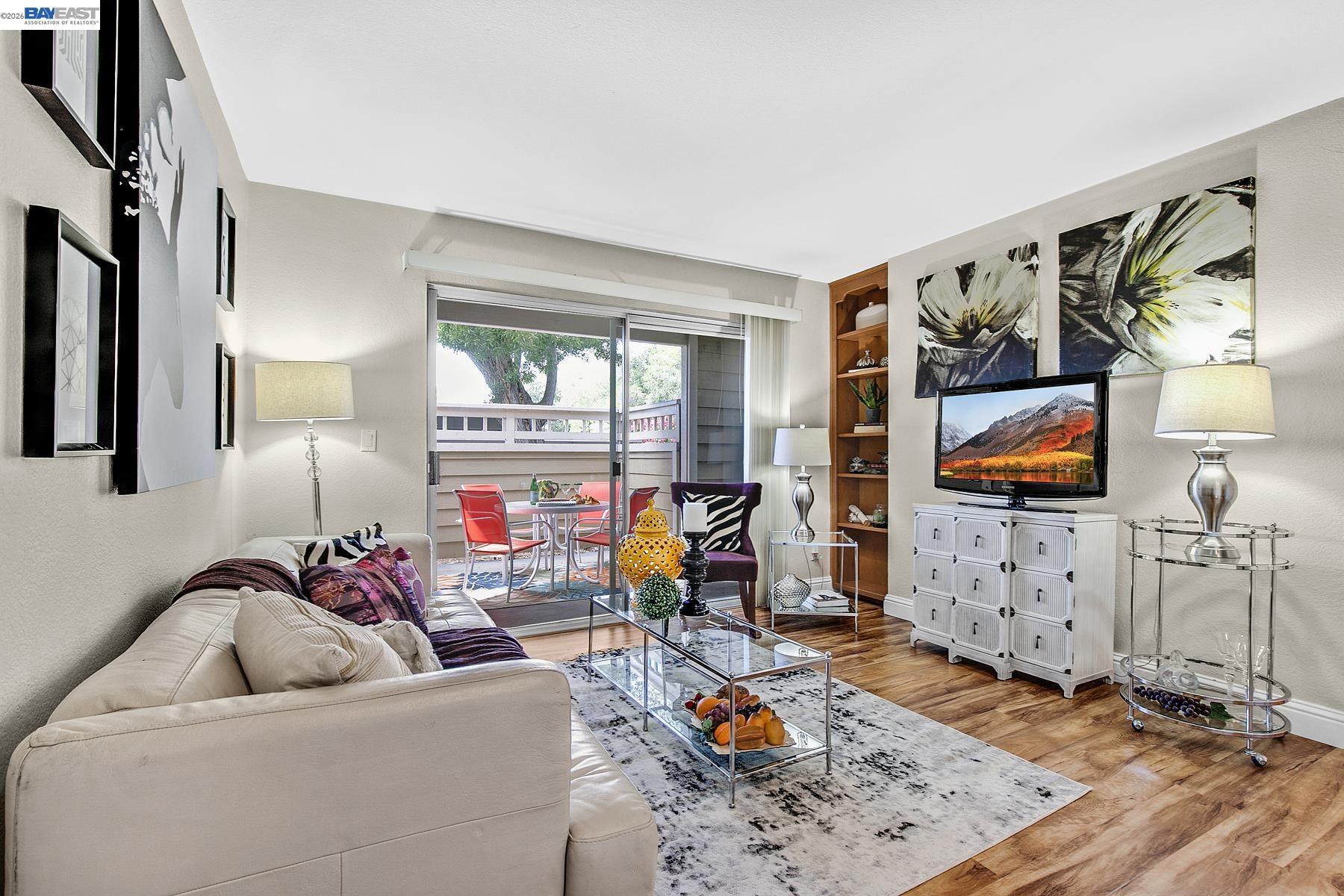 150 Reflections Drive, Unit 13 San Ramon, CA 94583 - Photo 6 of 33 a living room with furniture and a flat screen tv
