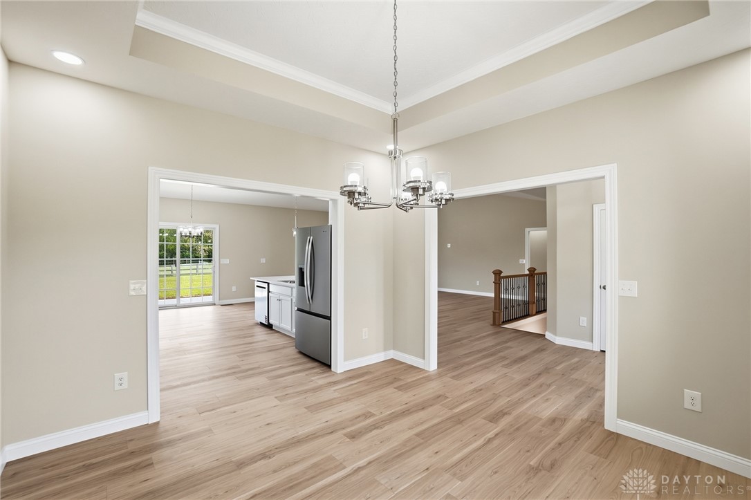 4600 Beal Road Franklin, OH 45005 - Photo 42 of 42 This bright interior features an open floorplan with durable flooring and stylish ceiling details.