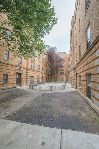 a view of a road with a building in the background