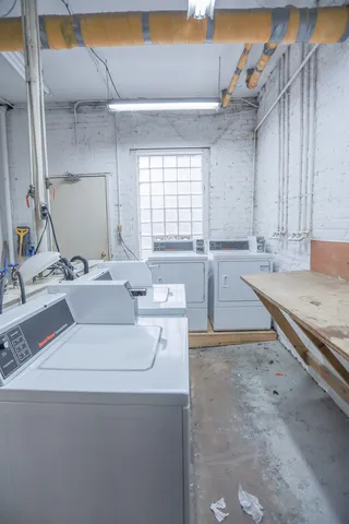 a kitchen with a sink and a stove top oven