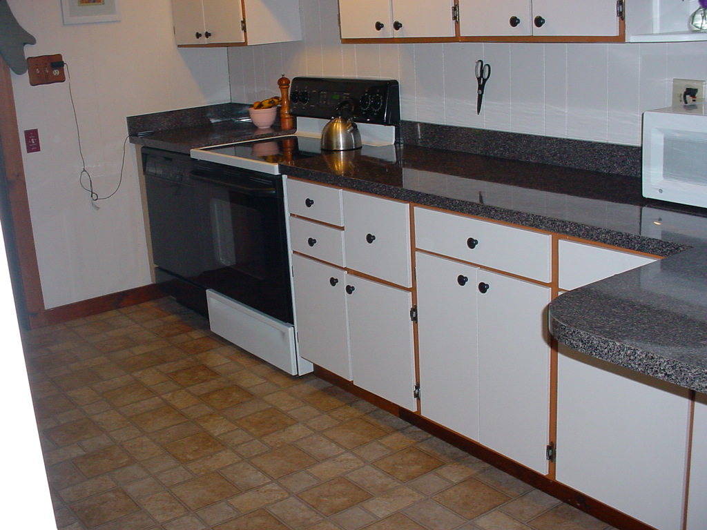 1330 Wade Inn Road Becket, MA 01223 - Photo 2 of 17 a kitchen with granite countertop a sink and a stove