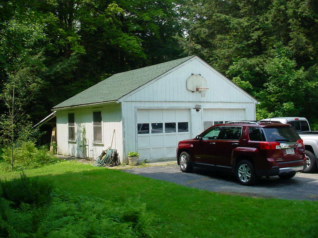 1330 Wade Inn Road Becket, MA 01223 - Photo 17 of 17 a front view of a house with a garden