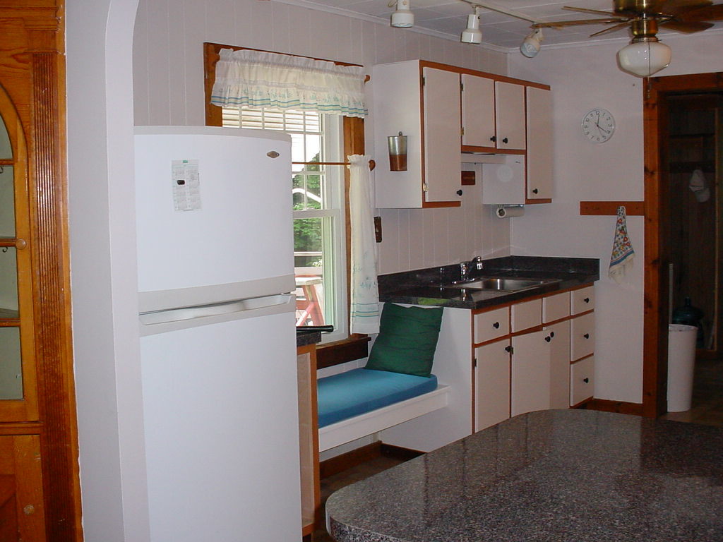 1330 Wade Inn Road Becket, MA 01223 - Photo 3 of 17 a kitchen with white cabinets and refrigerator