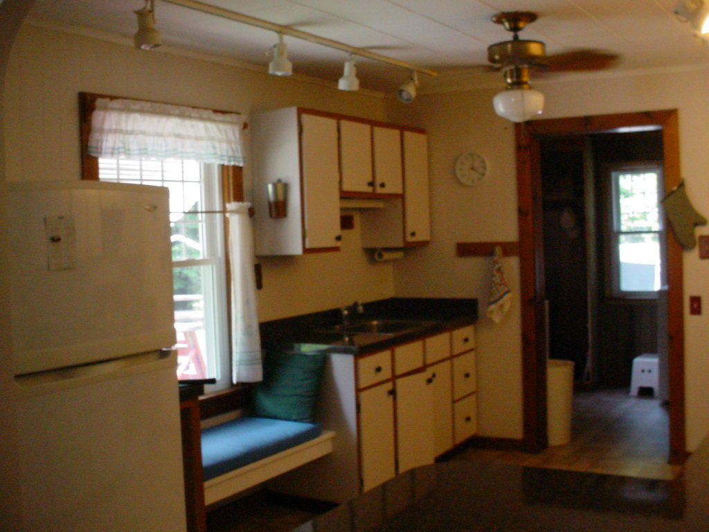 1330 Wade Inn Road Becket, MA 01223 - Photo 7 of 17 a kitchen with stainless steel appliances granite countertop a refrigerator a stove and a sink with wooden floor
