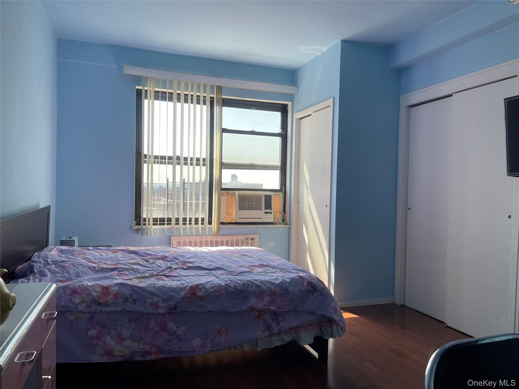 99-72 66th Road, Unit 9S Queens, NY 11374 - Photo 3 of 9 a bedroom with a bed and a window