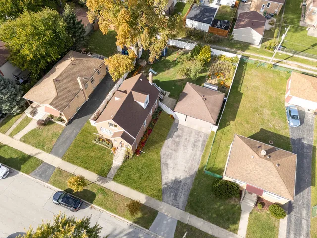 an aerial view of a house with a garden and plants
