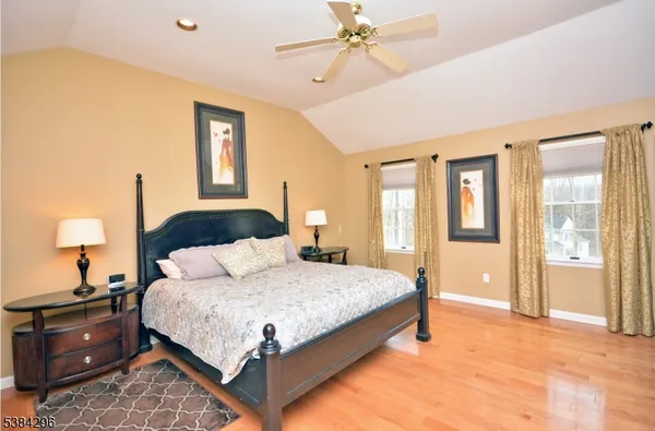 a bedroom with a bed and a lamp