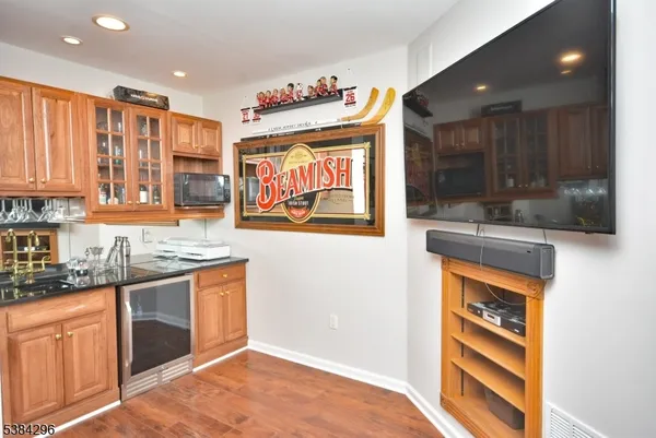 a view of a livingroom with furniture window and wooden floor