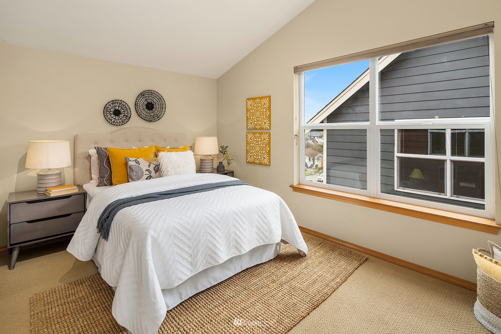 514 North 46th Street, Unit B Seattle, WA 98103 - Photo 18 of 30 a bedroom with a bed and a large window