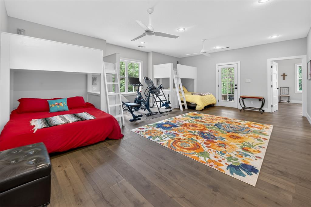 4747 Stonebridge Athens, TX 75751 - Photo 20 of 40 a bedroom with furniture and a wooden floor