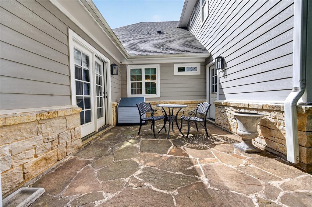 4747 Stonebridge Athens, TX 75751 - Photo 29 of 40 a patio with table and chairs and potted plants