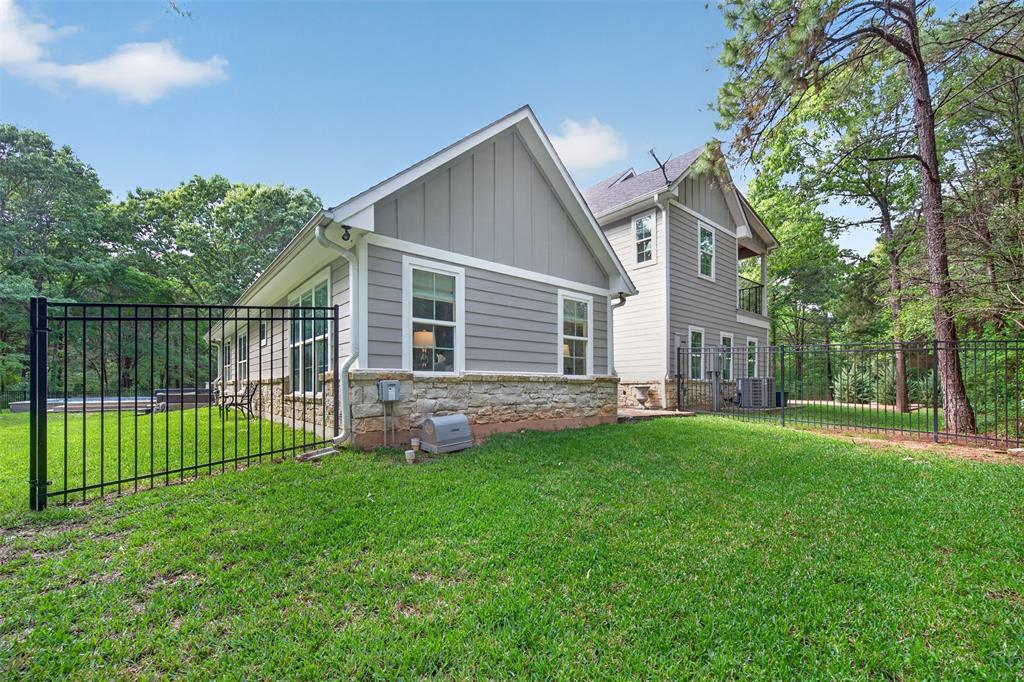 4747 Stonebridge Athens, TX 75751 - Photo 32 of 40 a front view of a house with a garden and yard