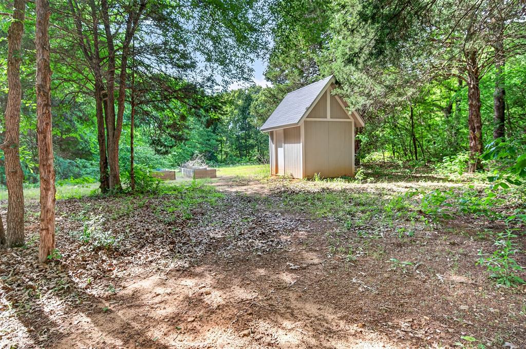 4747 Stonebridge Athens, TX 75751 - Photo 34 of 40 a dirt road with trees in the background