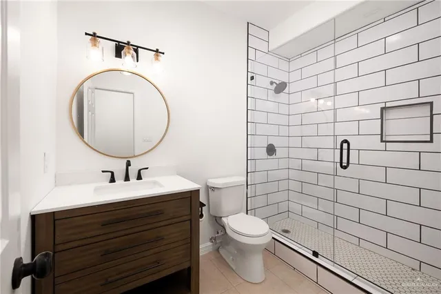 an empty room with a ceiling fan and a window