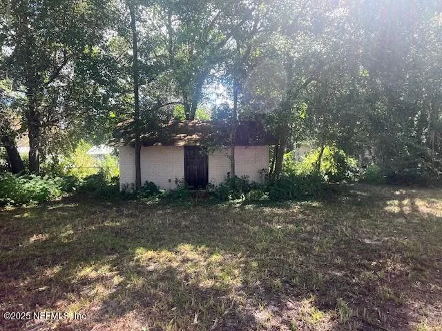 a backyard of a house with lots of green space