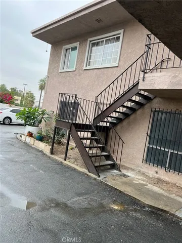 a view of balcony with wooden floor and outdoor seating