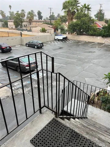 a view of street with parked cars