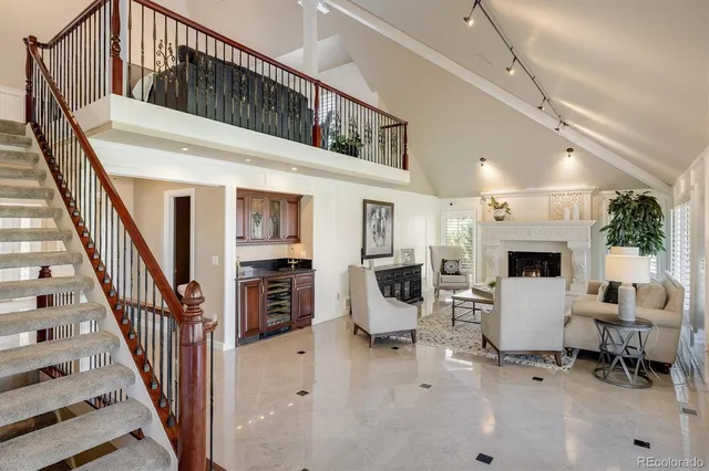a living room with furniture a window and a fireplace
