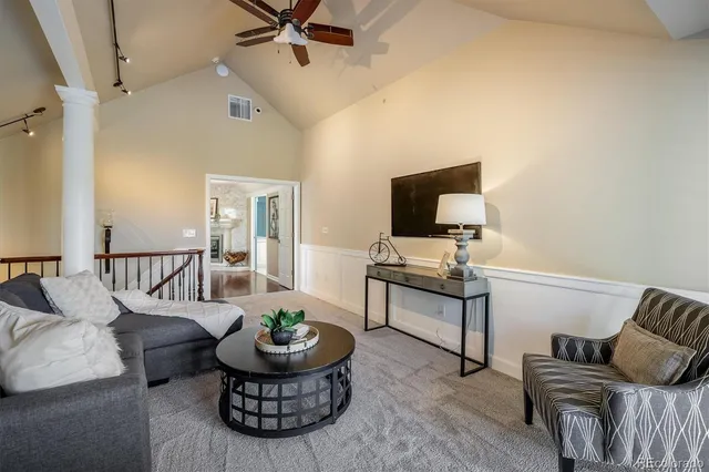 a spacious bedroom with a large bed and a fireplace