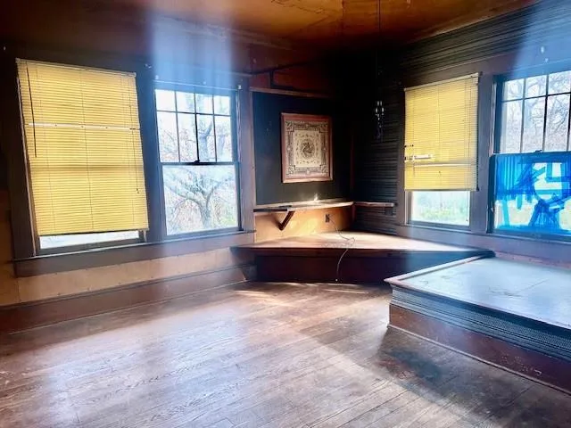 a living room filled with furniture and a large window