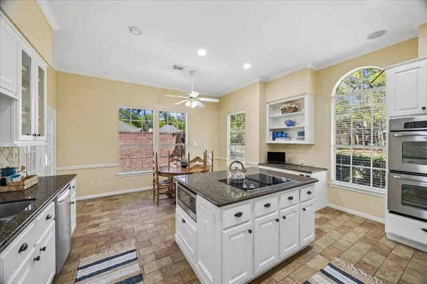 a kitchen that has a stove and a sink