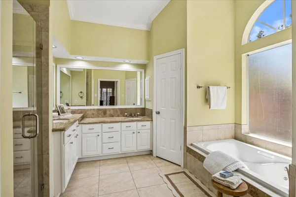 a bedroom with furniture and a window