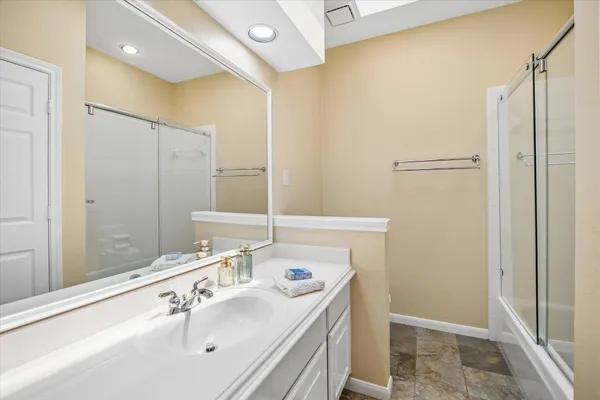 a view of a brick house with a backyard