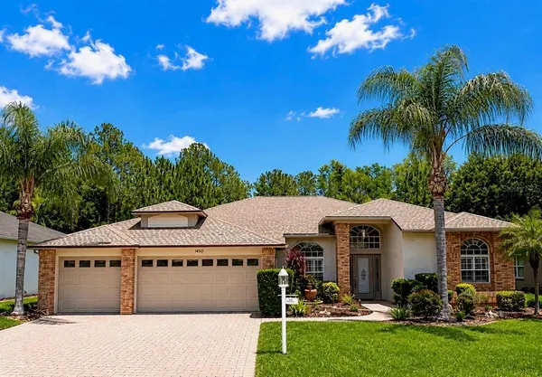 a view of house with outdoor space and swimming pool