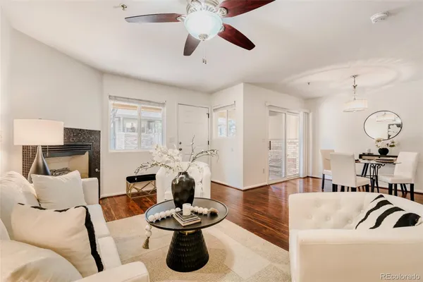 a living room with furniture and a lamp