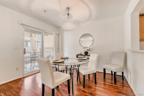 a view of a dining room with furniture window and wooden floor