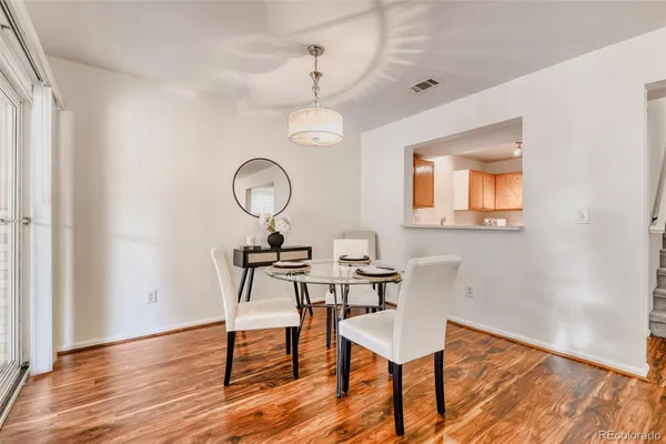 a view of a room that has a table and a chair