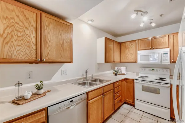 a kitchen with a sink cabinets and window