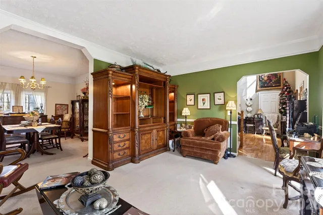a living room with furniture and gym equipment