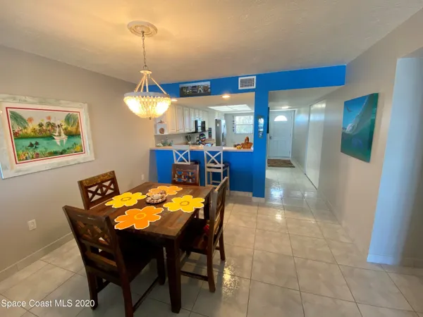 a kitchen with stainless steel appliances a sink a stove and cabinets