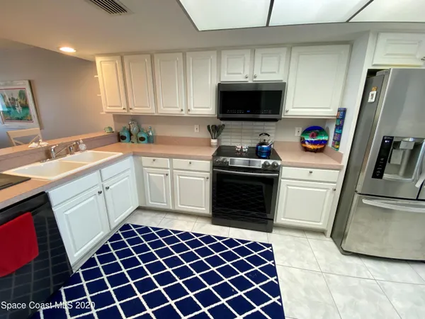 a bedroom with a bed a window and walk in closet