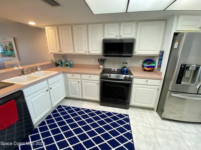 a bedroom with a bed a window and walk in closet