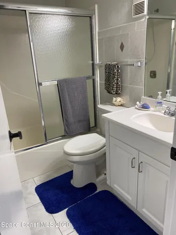 a view of a balcony with table and chairs