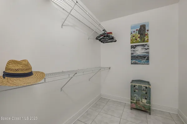 a bathroom with a toilet a sink a mirror and a shower