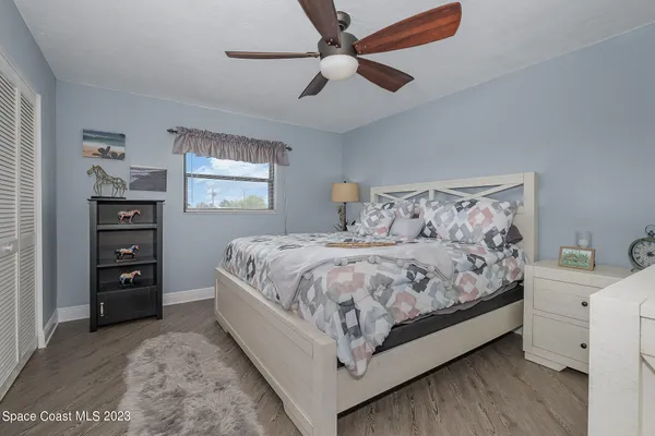 a large white bed in a white room