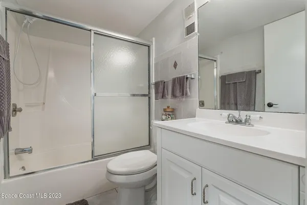 a view of a storage & utility room with washing machine