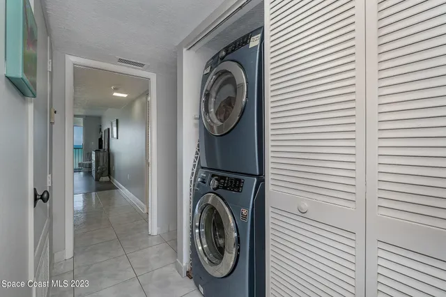a view of a dining room with furniture and a window