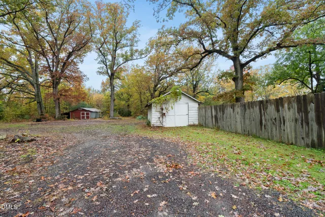 a house that has a tree in front of it