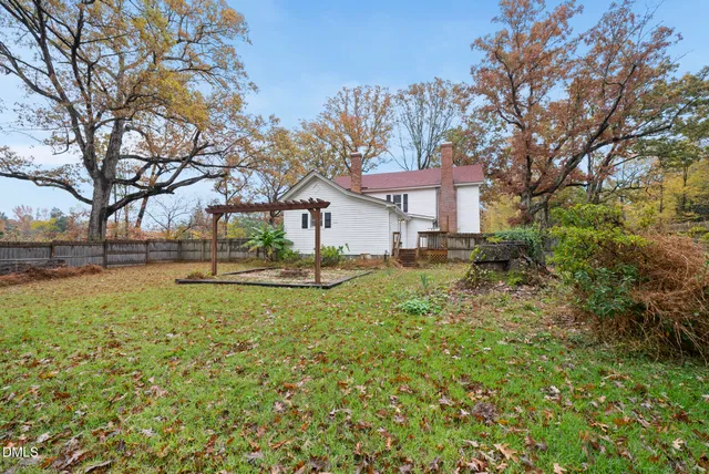 a view of a yard with a tree