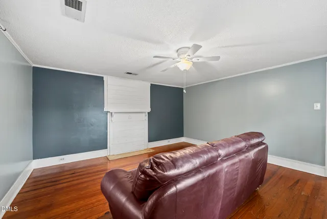 a view of a backyard with large trees