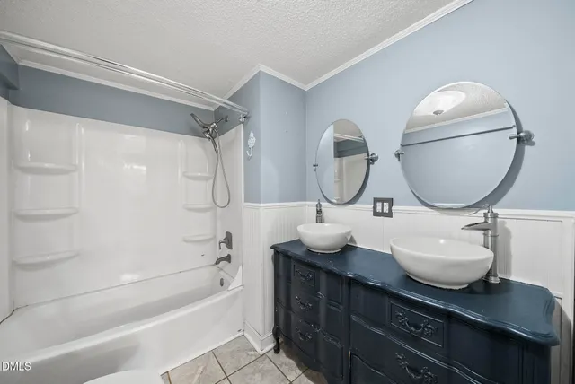 a large kitchen with cabinets stainless steel appliances and a window