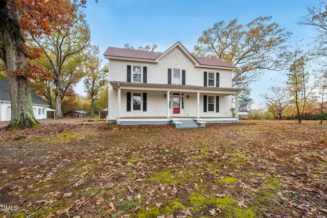a house with trees in front of it