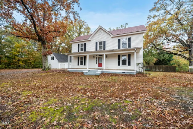 a black and white photo of a living room