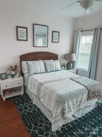 a bedroom with bed and window