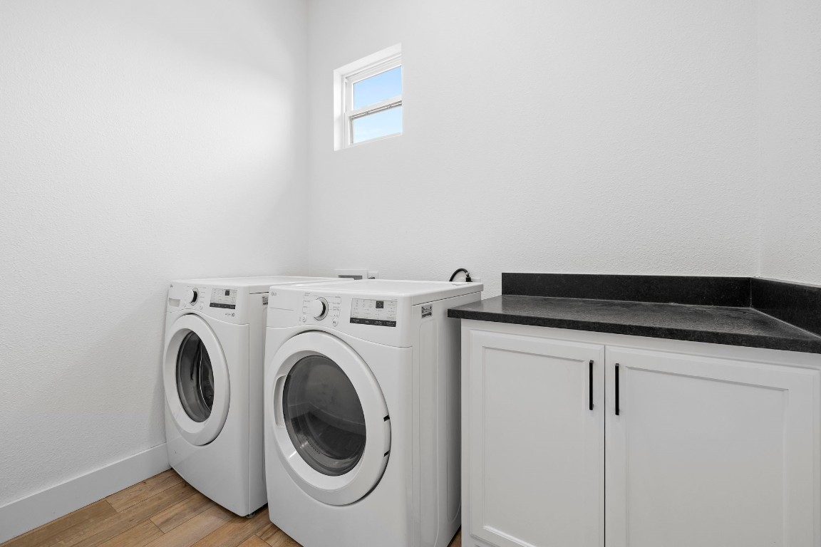 1463 Mountain Valley Road Concan, TX 78838 - Photo 17 of 43 a utility room with dryer and washer