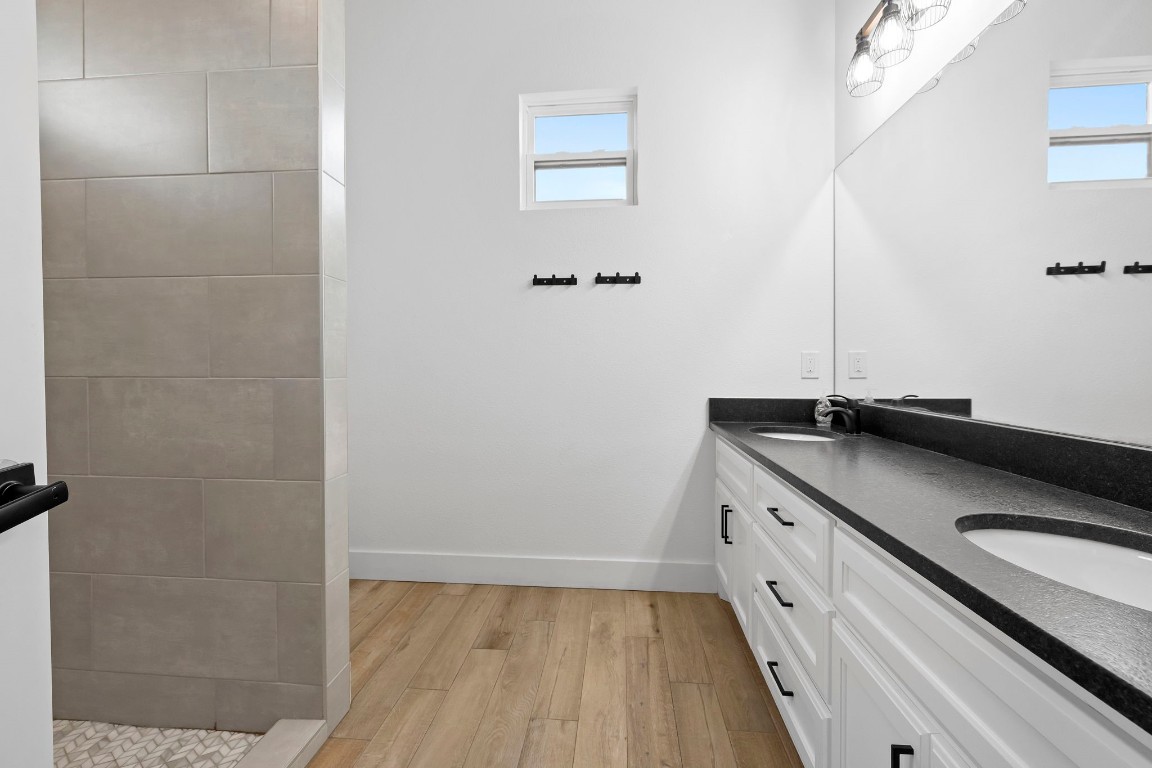 1463 Mountain Valley Road Concan, TX 78838 - Photo 19 of 43 a bathroom with a sink and a mirror
